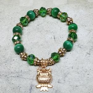Green bead bracelet with owl charm